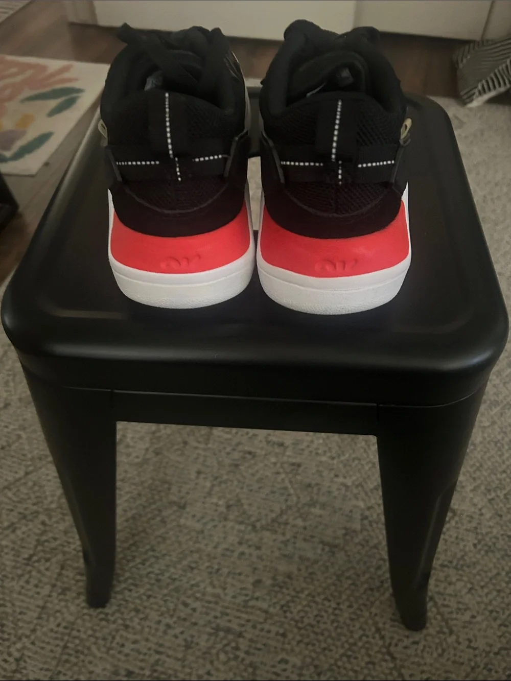 Women’s Jordans Black Athletic Sneakers with Red Accents